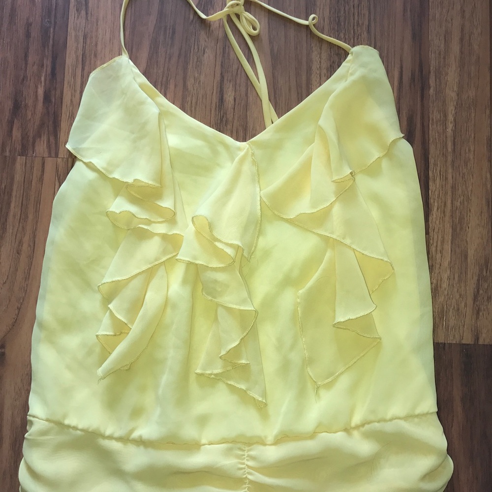 Yellow ruffled top.